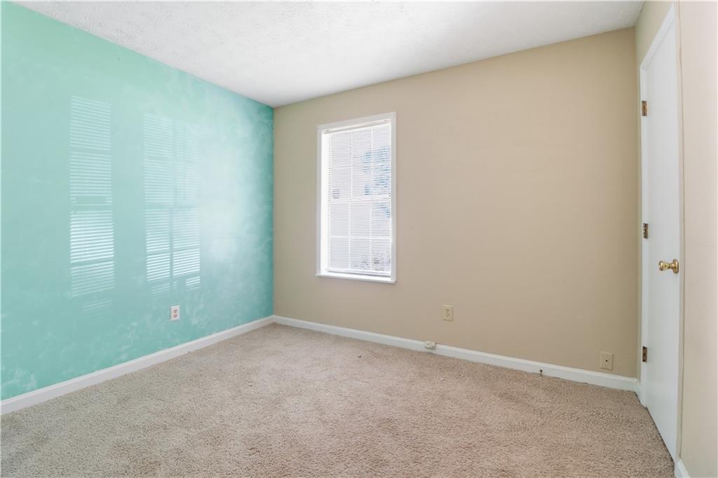 5288 Biffle Downs Road Stone Mountain, GA 30088 - Photo 15 of 18 a view of empty room with window