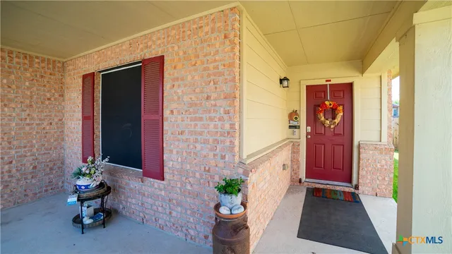 a front view of a house with chairs