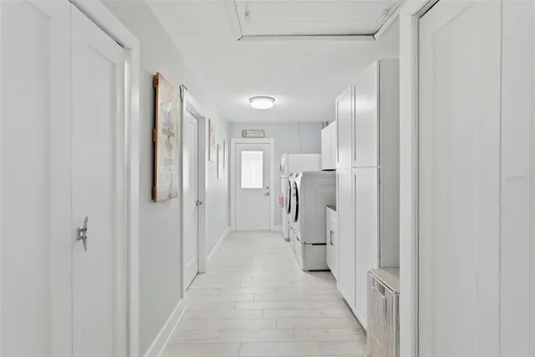 a view of a hallway with a white walls