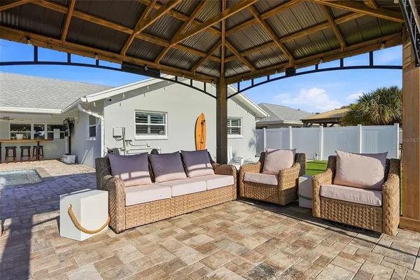 a outdoor space with patio couches and a umbrella