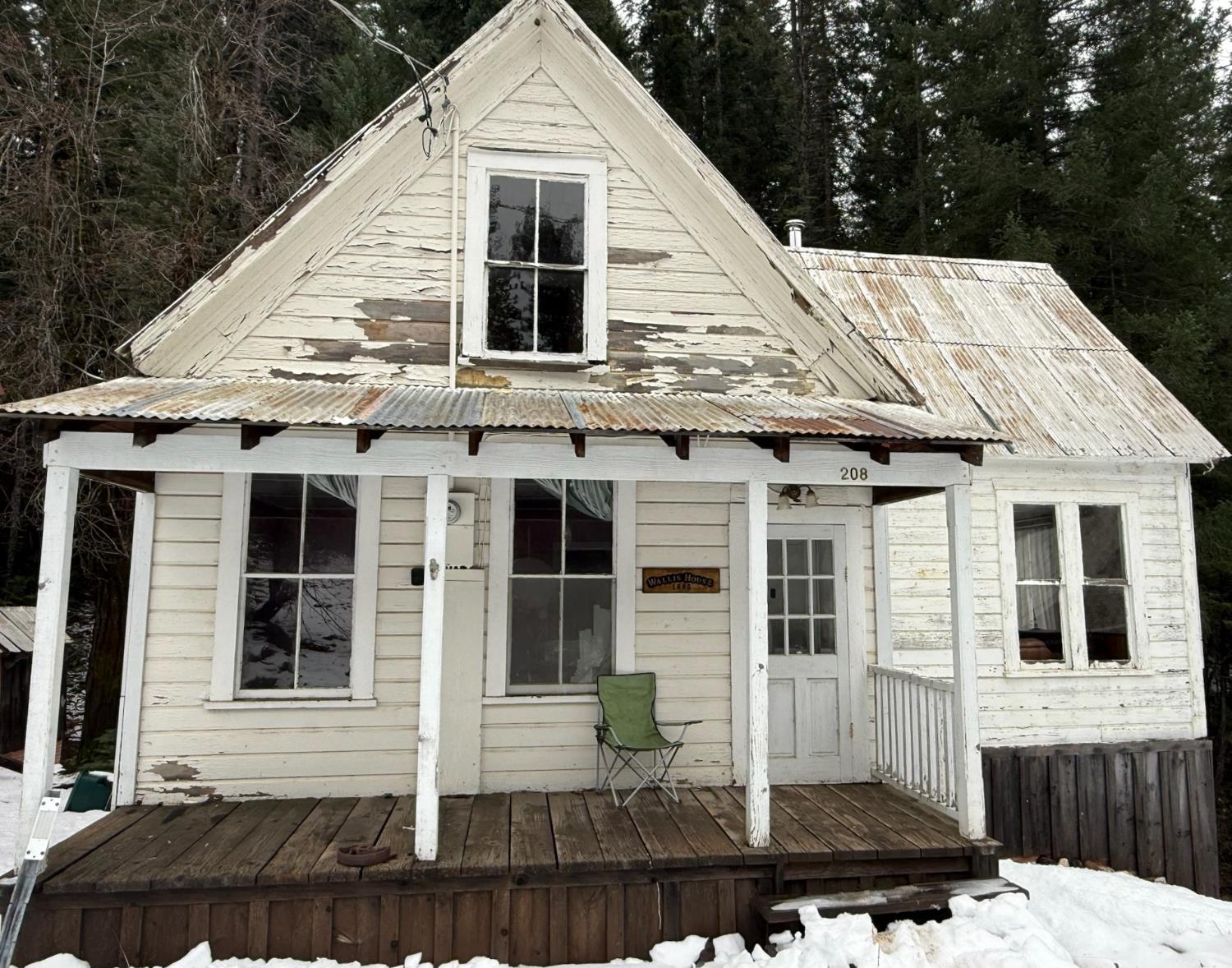 208 Main Street Alleghany, CA 95910 - Photo 1 of 24 a view of a white house with many windows