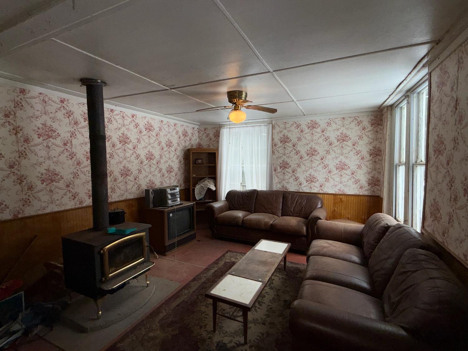 208 Main Street Alleghany, CA 95910 - Photo 2 of 24 a living room with furniture and a flat screen tv