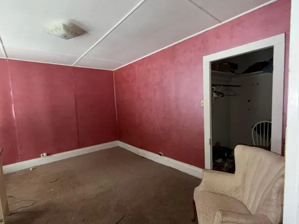a view of room with window and ceiling fan