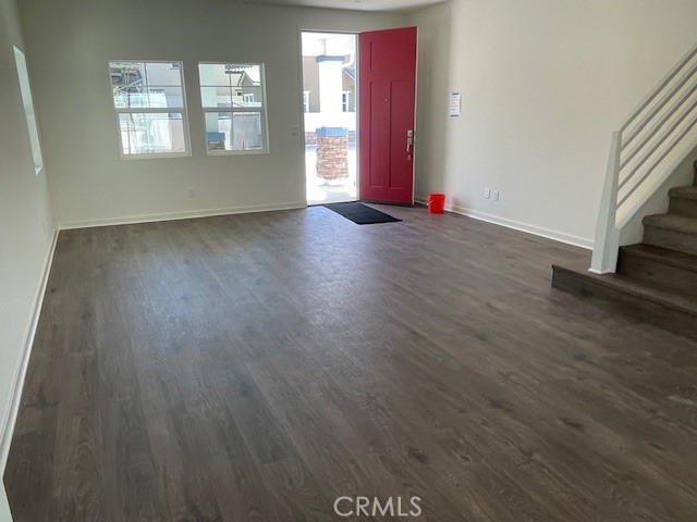 31960 Chagall Way Yucaipa, CA 92399 - Photo 11 of 12 an empty room with wooden floor and windows