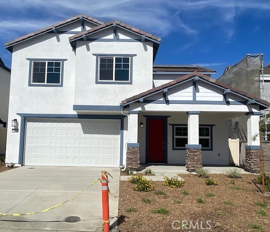 31960 Chagall Way Yucaipa, CA 92399 - Photo 2 of 12 a front view of a house with a porch