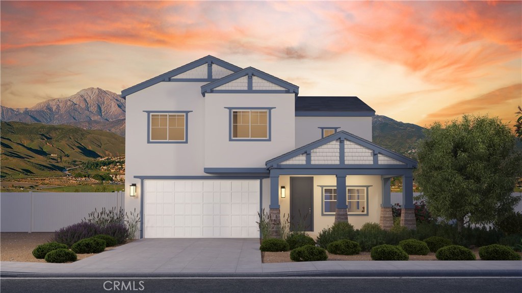 31960 Chagall Way Yucaipa, CA 92399 - Photo 3 of 12 a front view of a house with a yard and garage