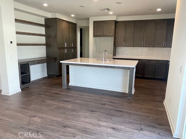 31960 Chagall Way Yucaipa, CA 92399 - Photo 5 of 12 a kitchen with kitchen island a sink stainless steel appliances and cabinets