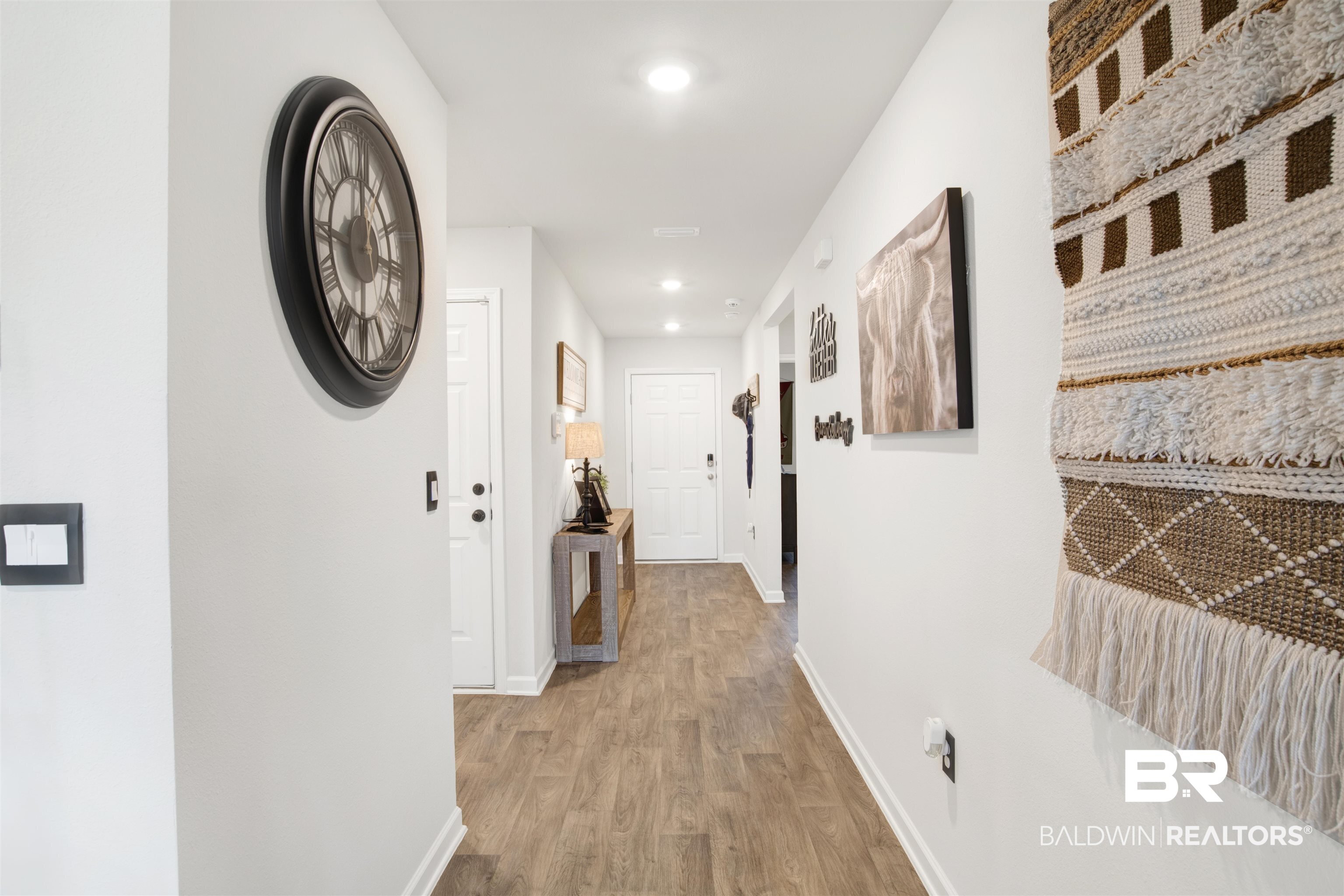 14731 Forsythia Loop Silverhill, AL 36576 - Photo 15 of 25 Corridor featuring light hardwood / wood-style flooring