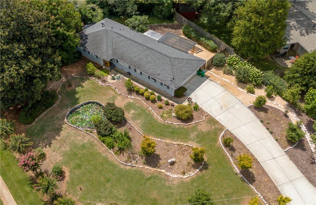 4033 Chamblee Tucker Road Atlanta, GA 30340 - Photo 1 of 1 an aerial view of a house with a yard and greenery