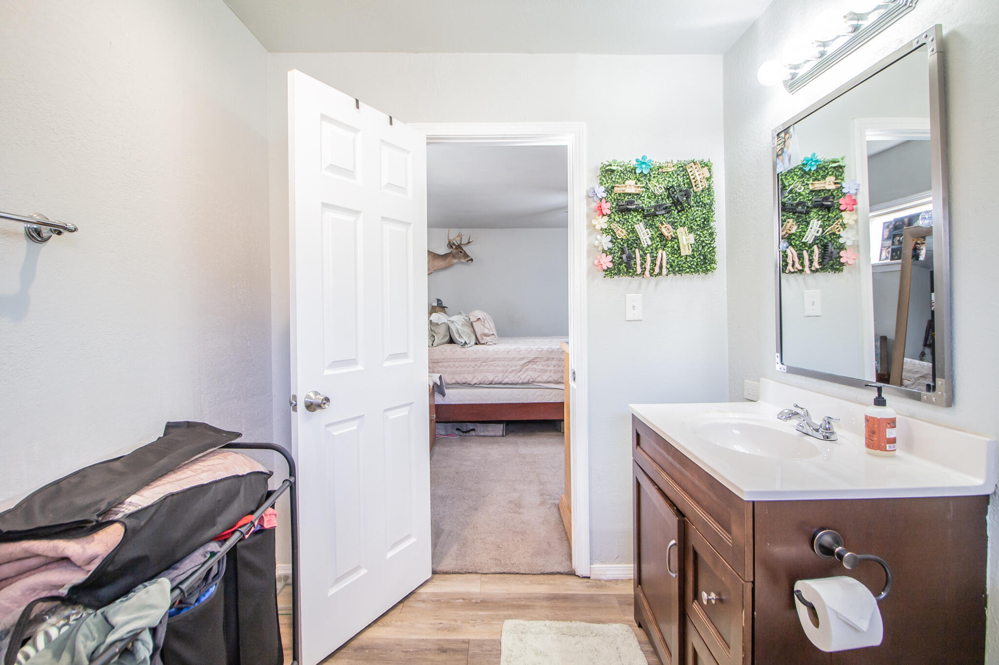 6403 23rd Street Lubbock, TX 79407 - Photo 16 of 29 a en suite bathroom with a sink and a mirror