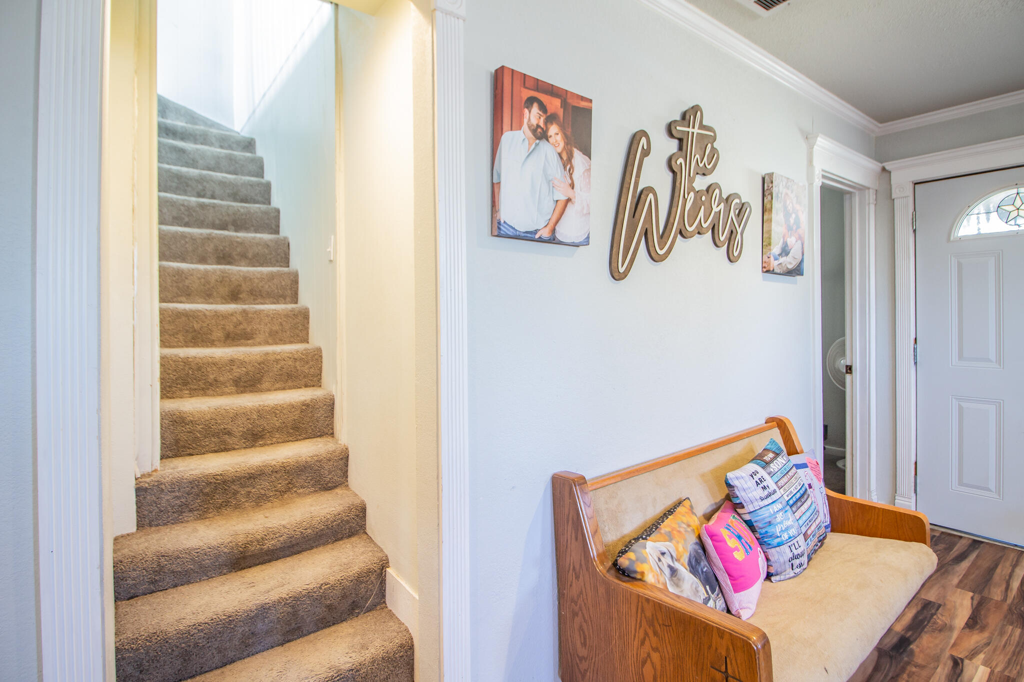 6403 23rd Street Lubbock, TX 79407 - Photo 20 of 29 a view of a hallway with stairs and a couch