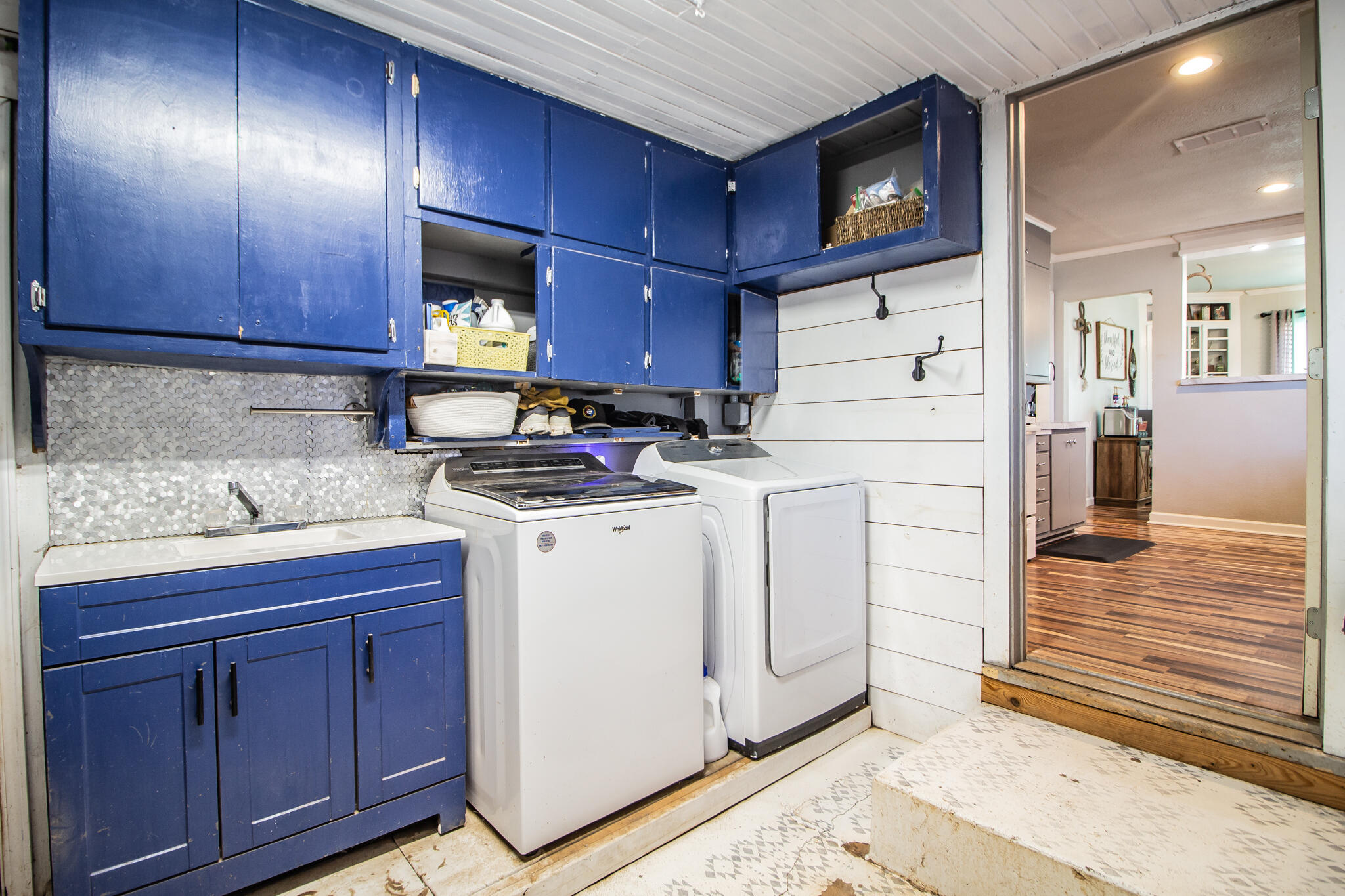 6403 23rd Street Lubbock, TX 79407 - Photo 22 of 29 a utility room with cabinets washer and dryer