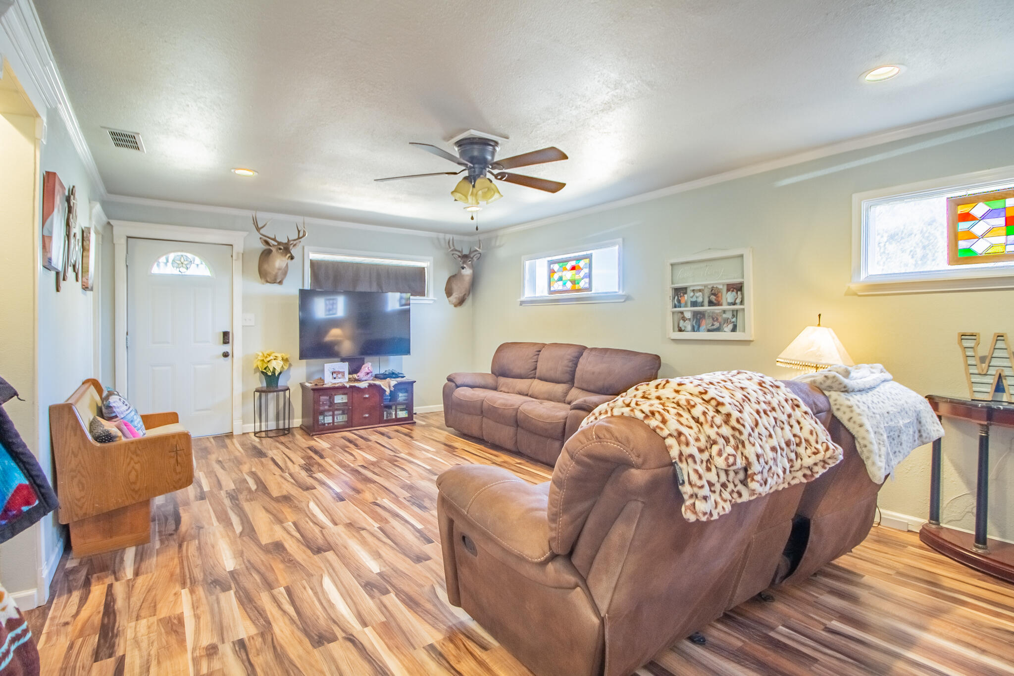6403 23rd Street Lubbock, TX 79407 - Photo 4 of 29 a living room with a bed and furniture