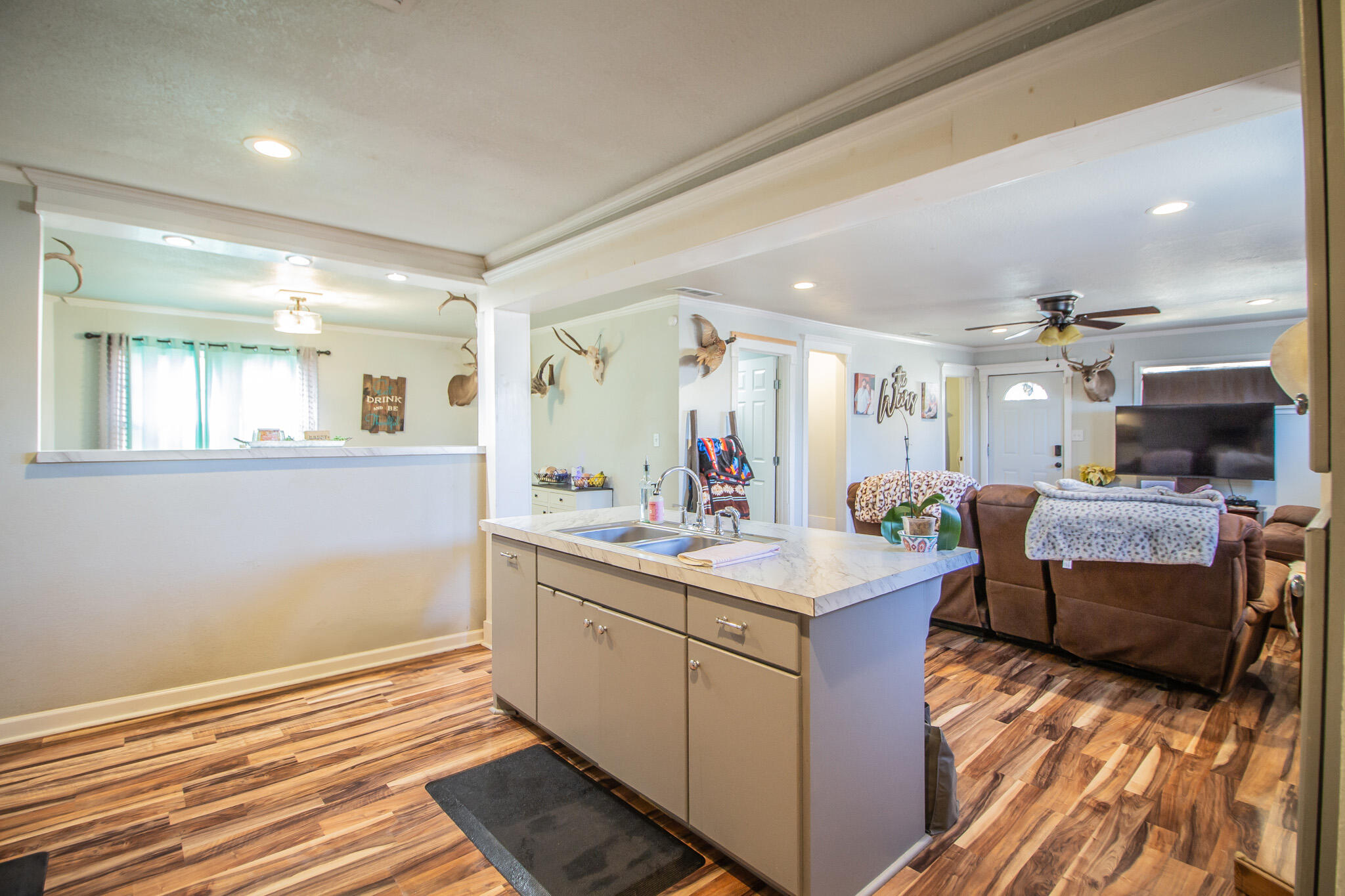 6403 23rd Street Lubbock, TX 79407 - Photo 9 of 29 a view of living room kitchen with granite countertop furniture and fireplace
