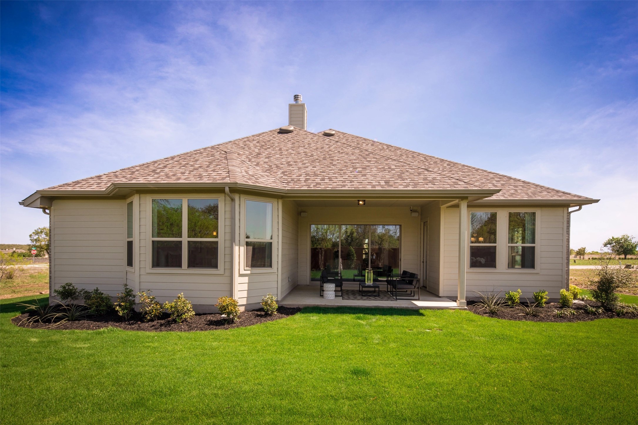 1229 Terrace View Drive Georgetown, TX 78628 - Photo 17 of 17 A well-maintained lawn stretches behind this charming single-story residence with an inviting covered patio.