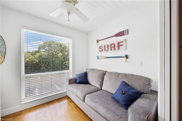 a living room with furniture and a window