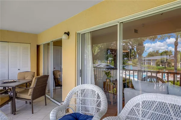a view of swimming pool with a garden and trees