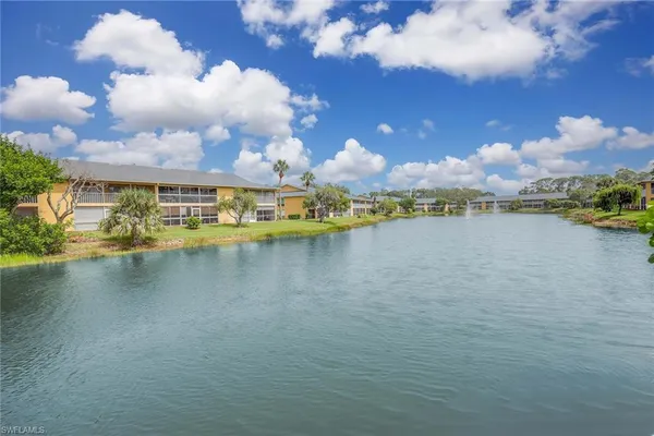 a view of balcony with wooden floor and lake view