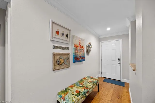 a bed room with a bed and a painting on the wall