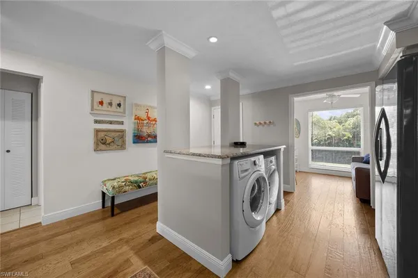 a view of a hallway with washer and dryer