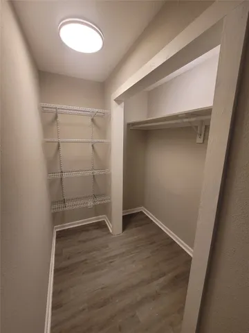 a bathroom with a double vanity sink and mirror with window
