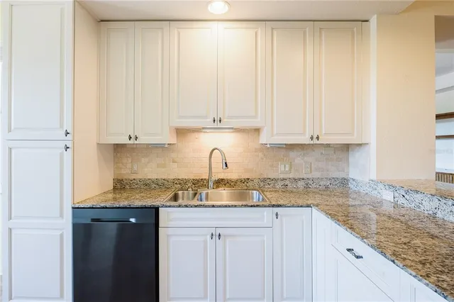 a view of an empty room with windows