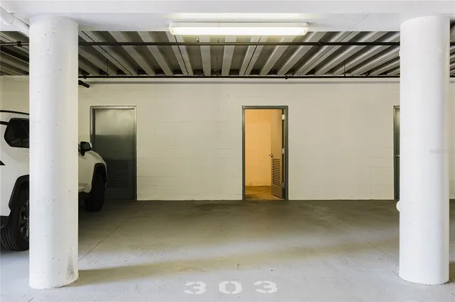 a view of a patio with a table and chairs under an umbrella