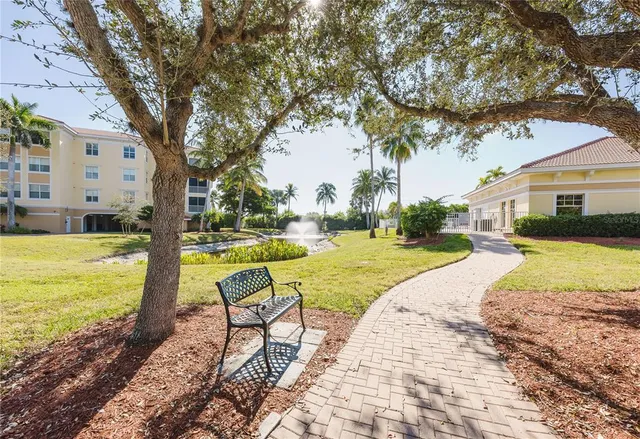 a park view with a bench and trees