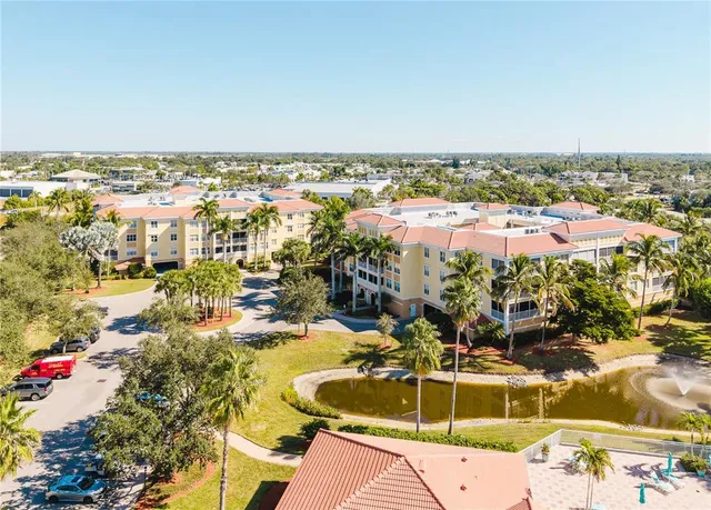 a living room with fireplace furniture and a chandelier