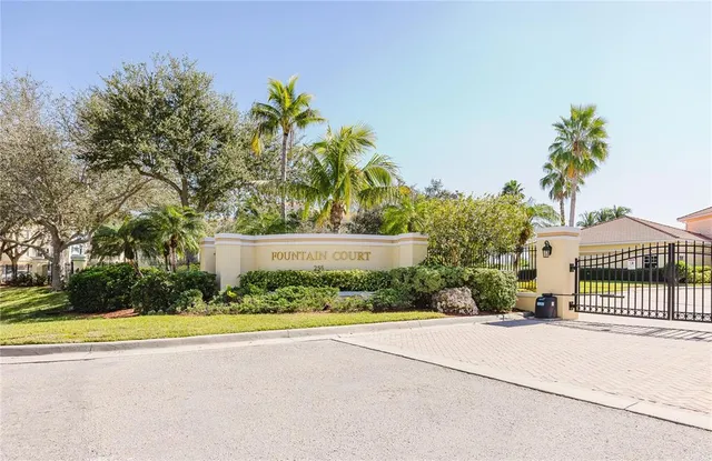 a picture of a building with a lot of flower plants