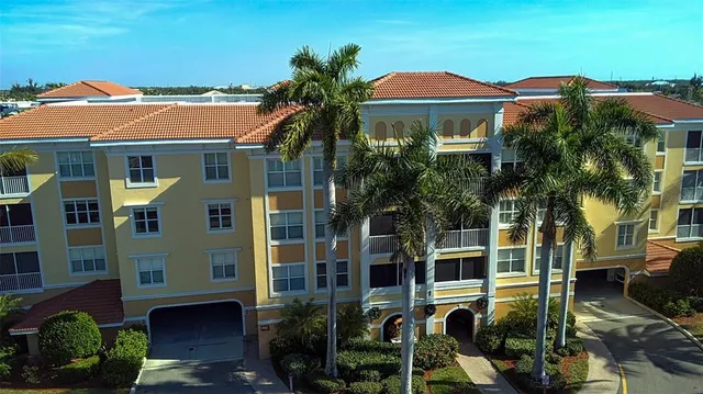 a aerial view of a house with a yard basket ball court and outdoor seating