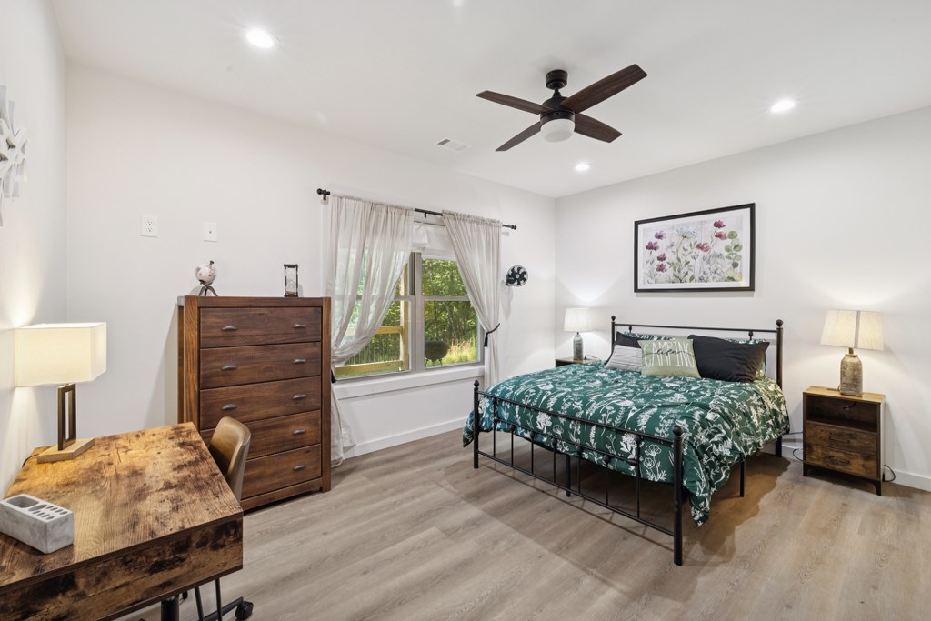 345 Deer Trail Mineral Bluff, GA 30559 - Photo 24 of 31 a bedroom with a bed dresser and a window