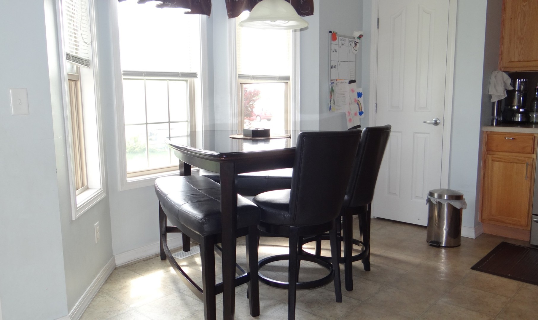 806 Cobblefield Road Champaign, IL 61822 - Photo 7 of 20 a view of a dining room with furniture and a window