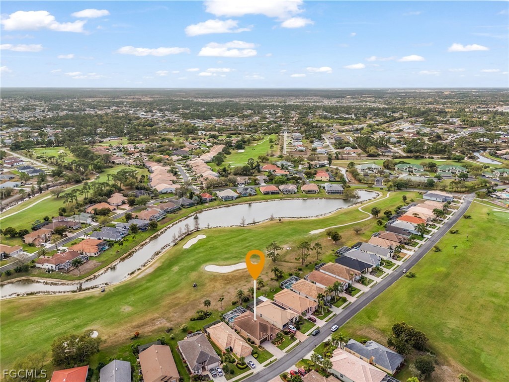 2090 Oxford Ridge Circle Lehigh Acres, FL 33973 - Photo 25 of 27 an aerial view of a city