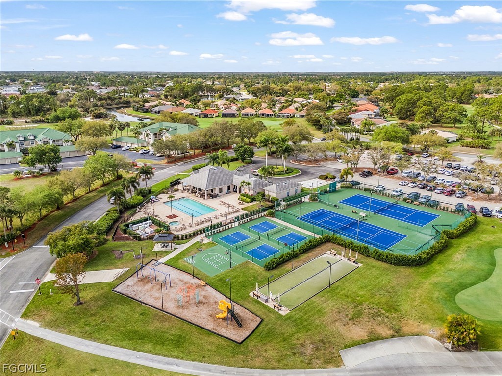2090 Oxford Ridge Circle Lehigh Acres, FL 33973 - Photo 26 of 27 an aerial view of tennis court