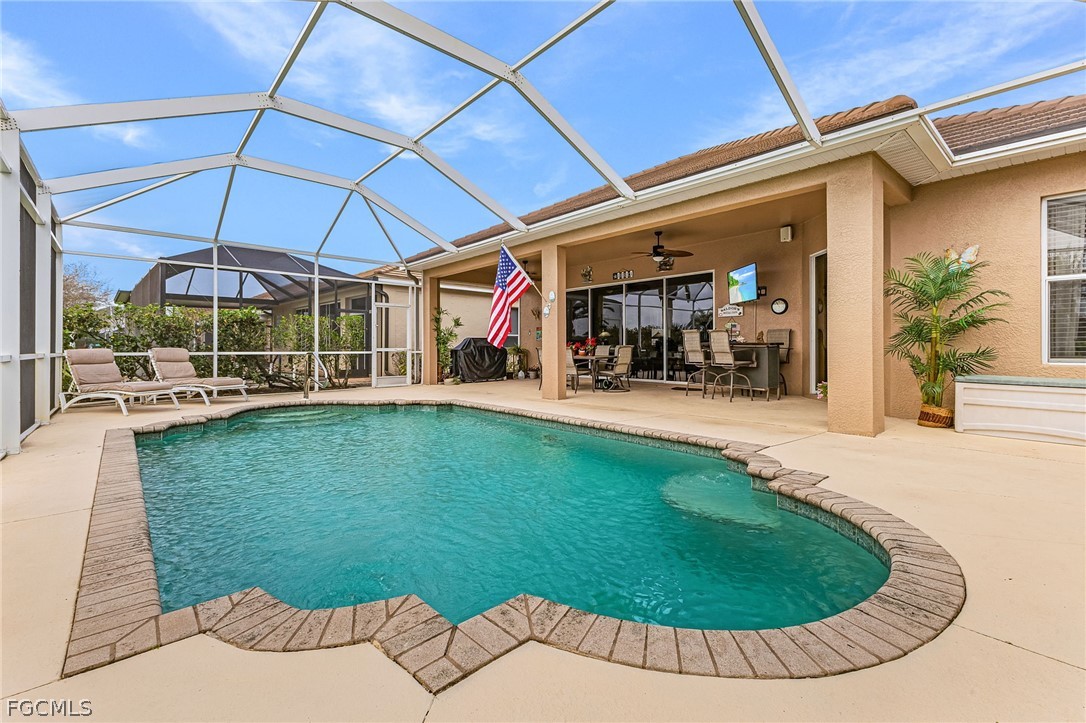 2090 Oxford Ridge Circle Lehigh Acres, FL 33973 - Photo 3 of 27 an outdoor space with garden