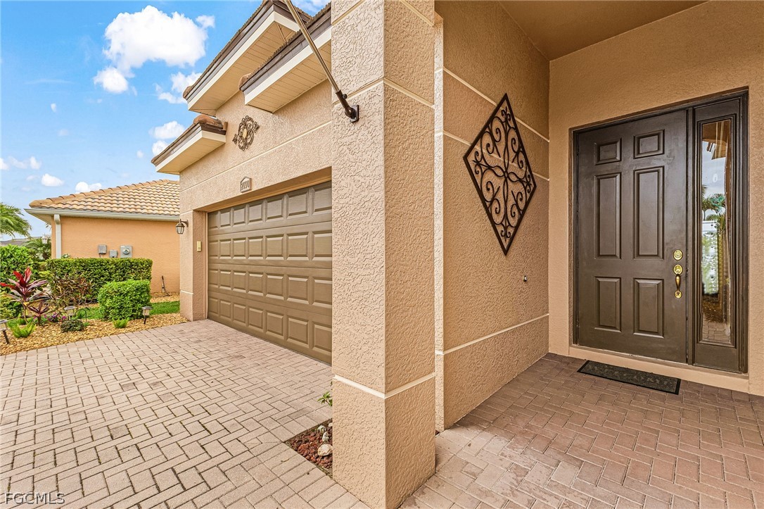 2090 Oxford Ridge Circle Lehigh Acres, FL 33973 - Photo 7 of 27 a view of entryway with front door