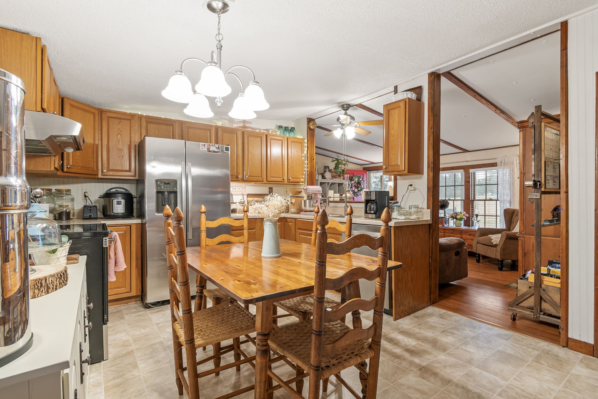 253 Henslee Road Shelbyville, TN 37160 - Photo 11 of 47 a dining room filled with furniture and a chandelier