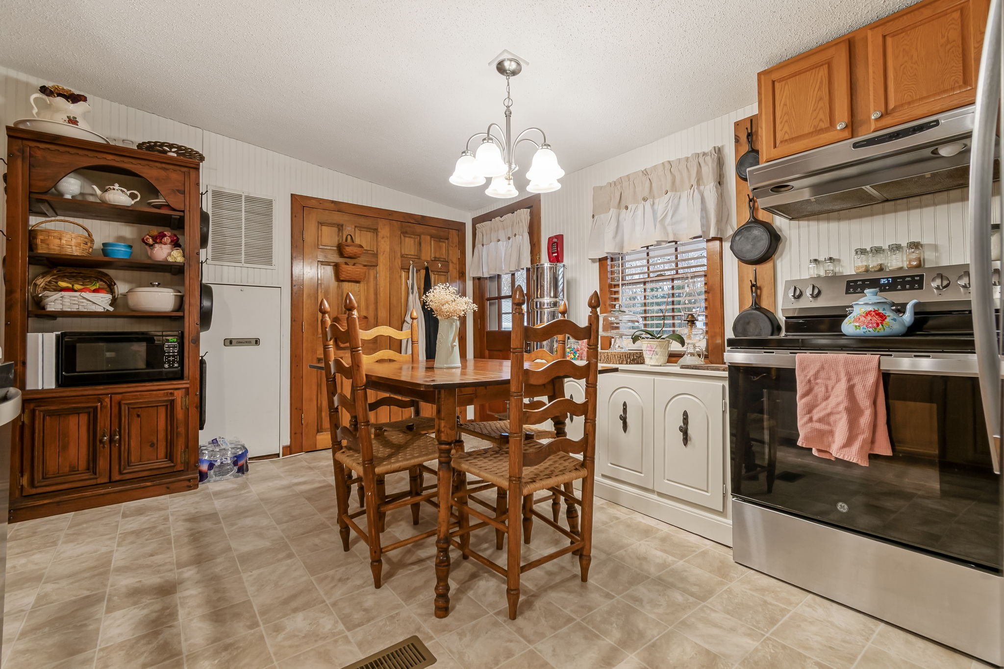 253 Henslee Road Shelbyville, TN 37160 - Photo 14 of 47 a view of a dining room with furniture cabinet and window