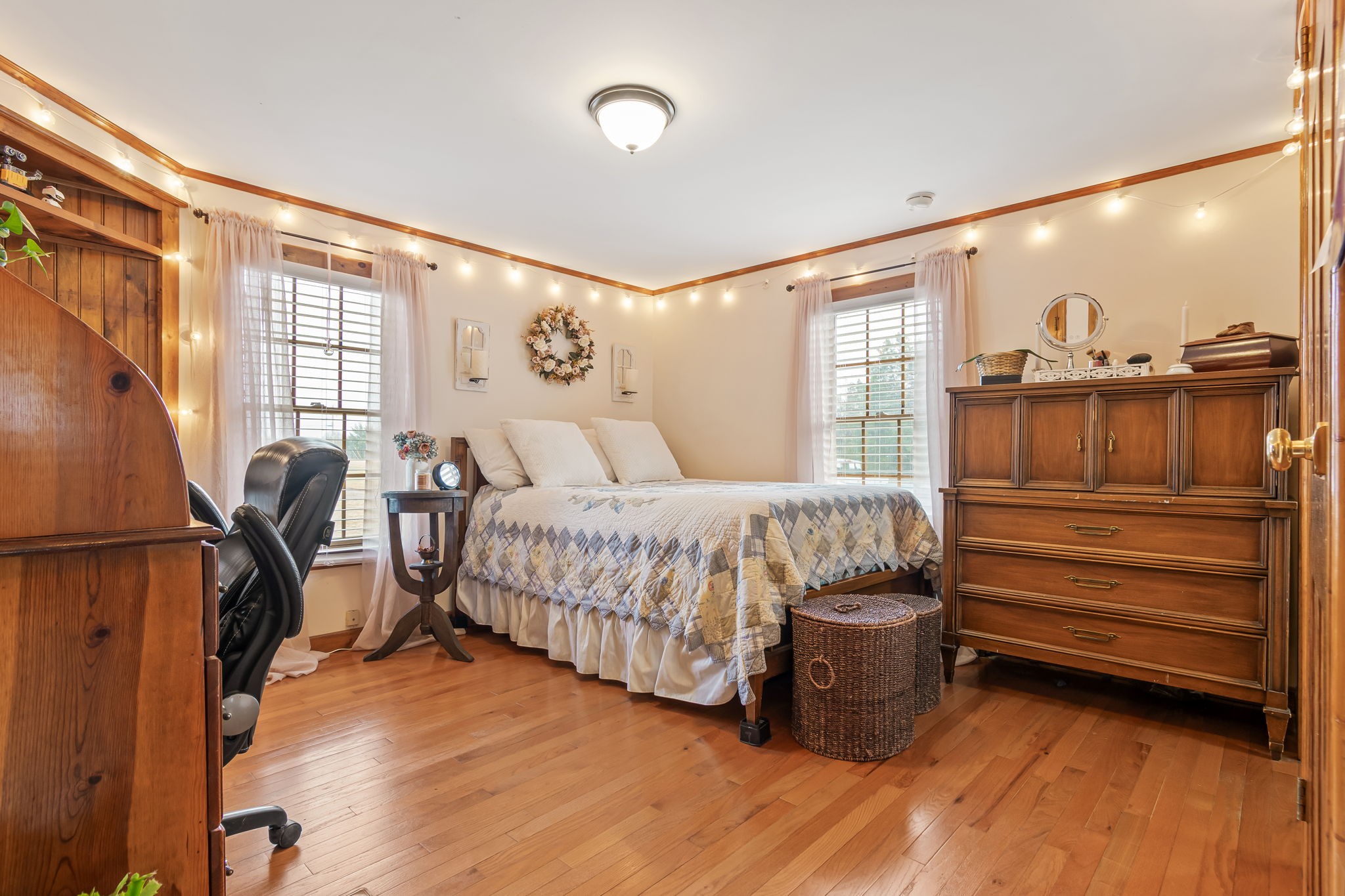 253 Henslee Road Shelbyville, TN 37160 - Photo 15 of 47 a bedroom with a bed and wooden floor