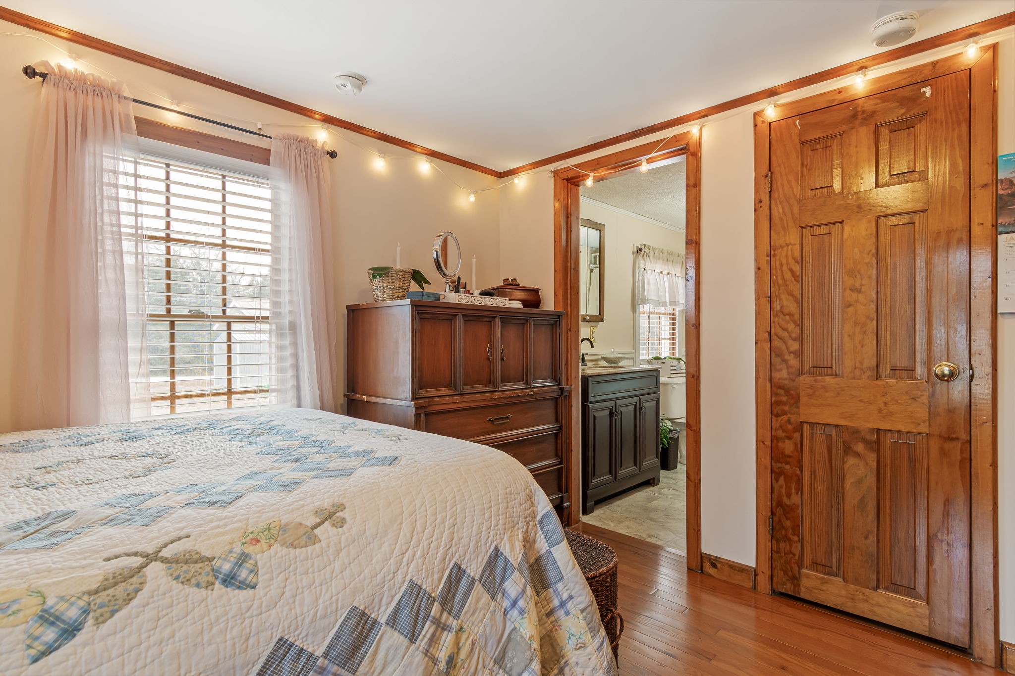 253 Henslee Road Shelbyville, TN 37160 - Photo 17 of 47 a bedroom with a bed and wooden floor