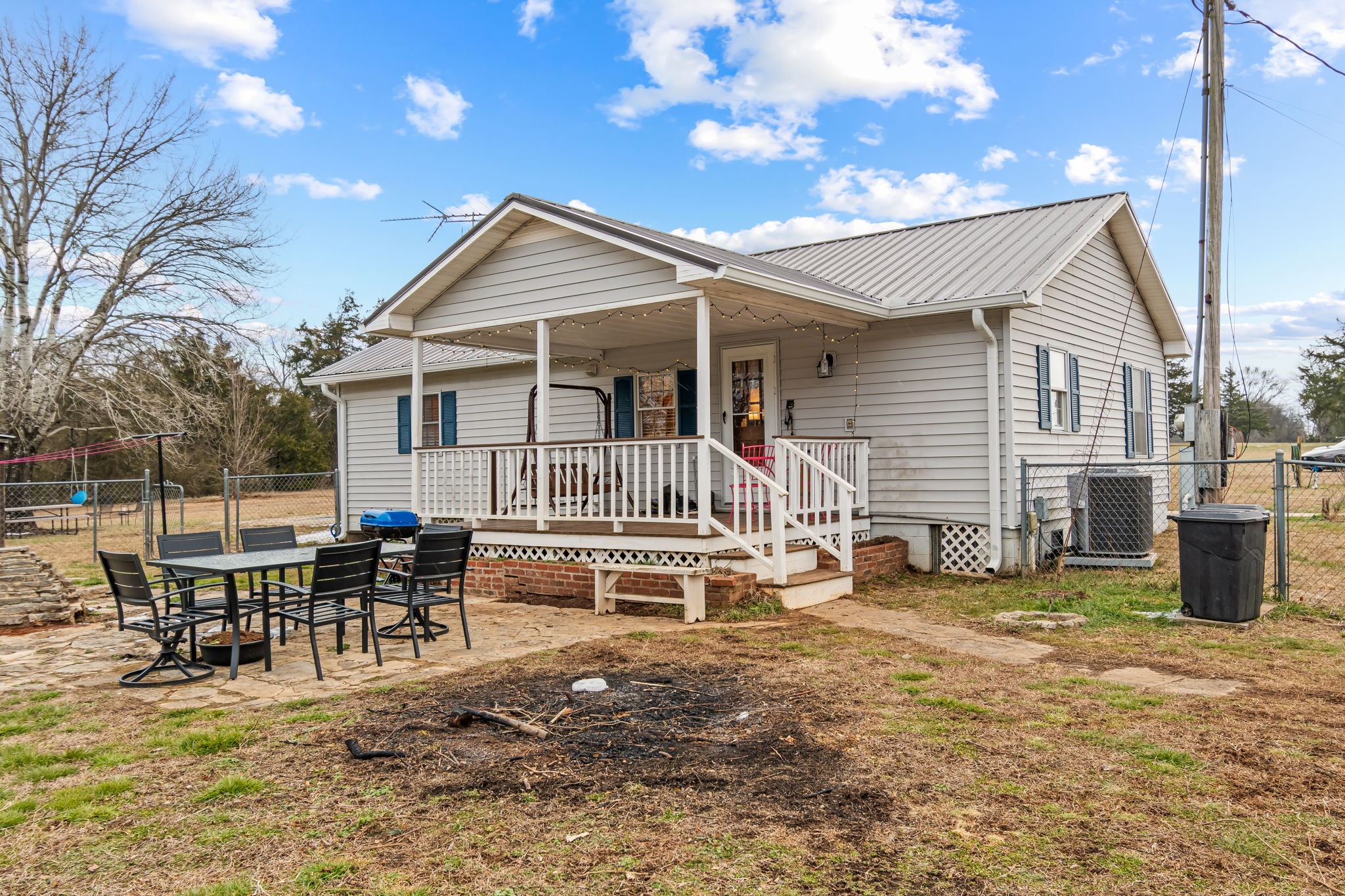 253 Henslee Road Shelbyville, TN 37160 - Photo 33 of 47 a view of a house with a patio and a yard