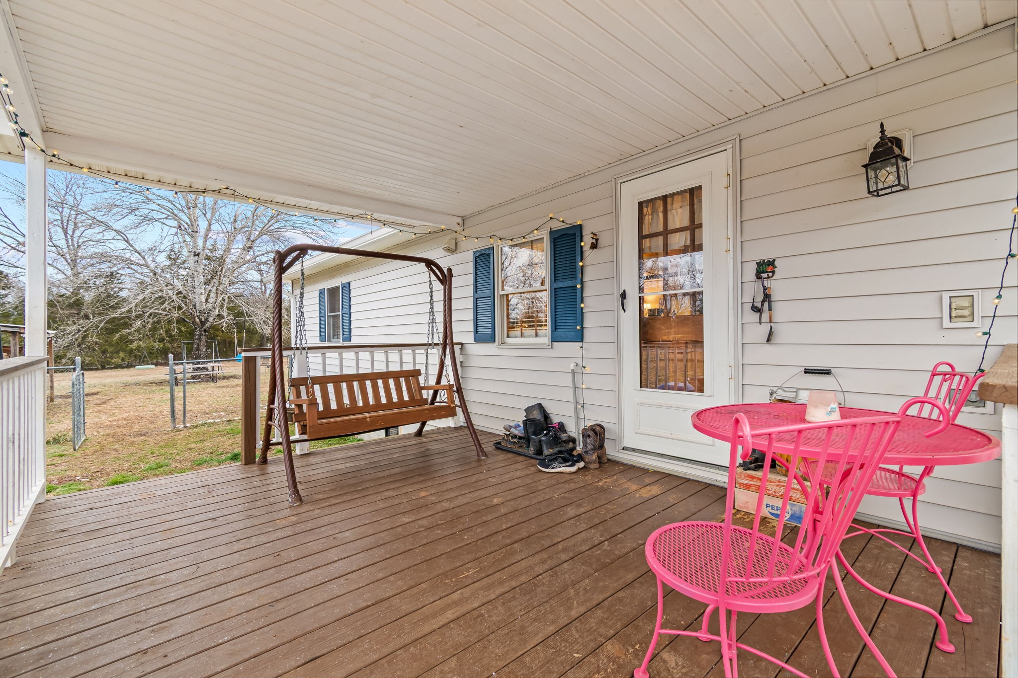 253 Henslee Road Shelbyville, TN 37160 - Photo 34 of 47 a balcony with chairs and wooden floor