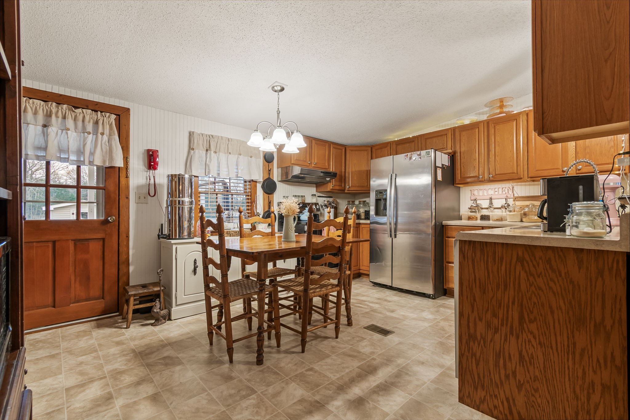 253 Henslee Road Shelbyville, TN 37160 - Photo 9 of 47 a kitchen with refrigerator and cabinets