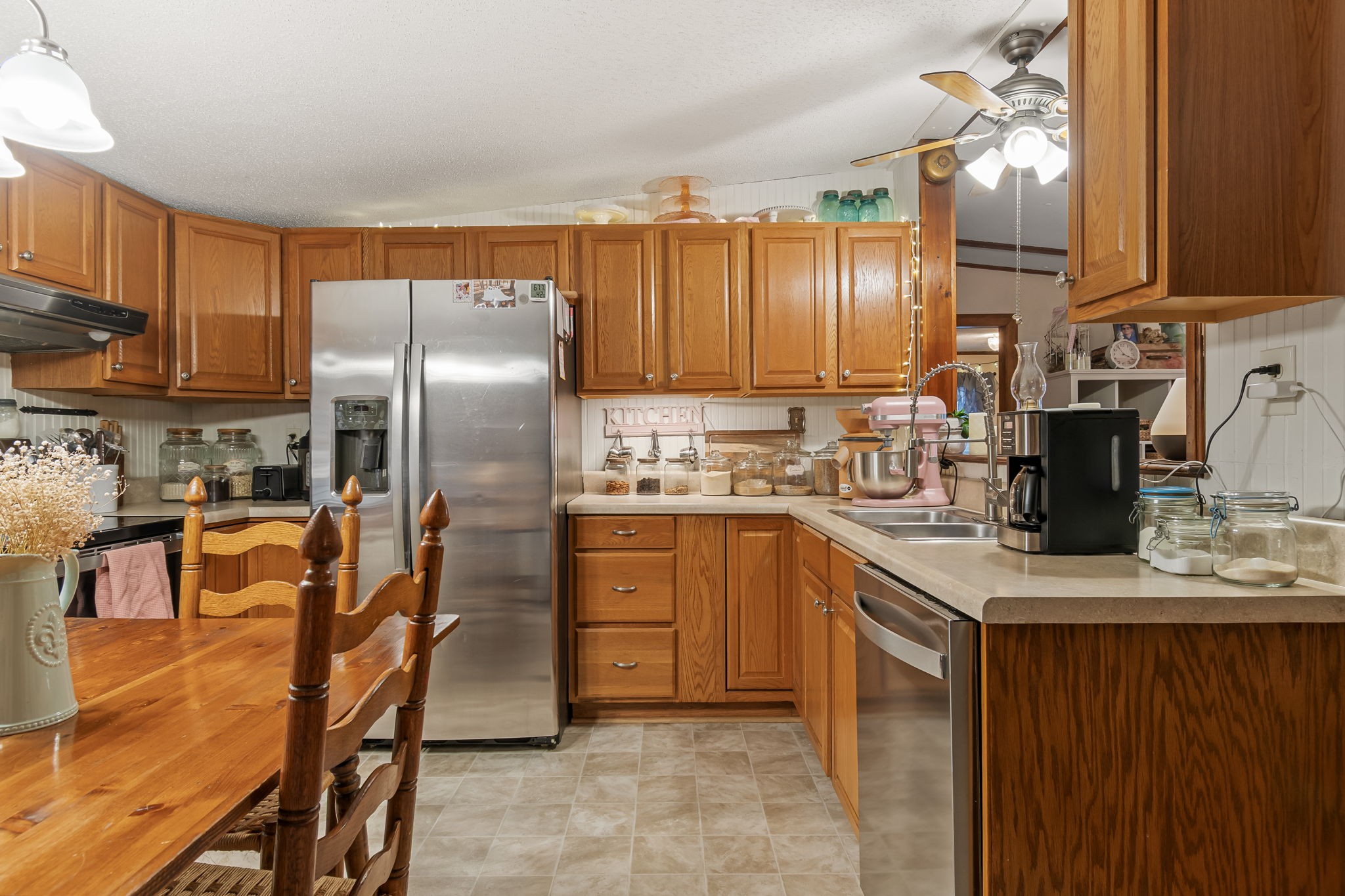 253 Henslee Road Shelbyville, TN 37160 - Photo 10 of 47 a kitchen with stainless steel appliances granite countertop a refrigerator a stove top oven a sink and dishwasher