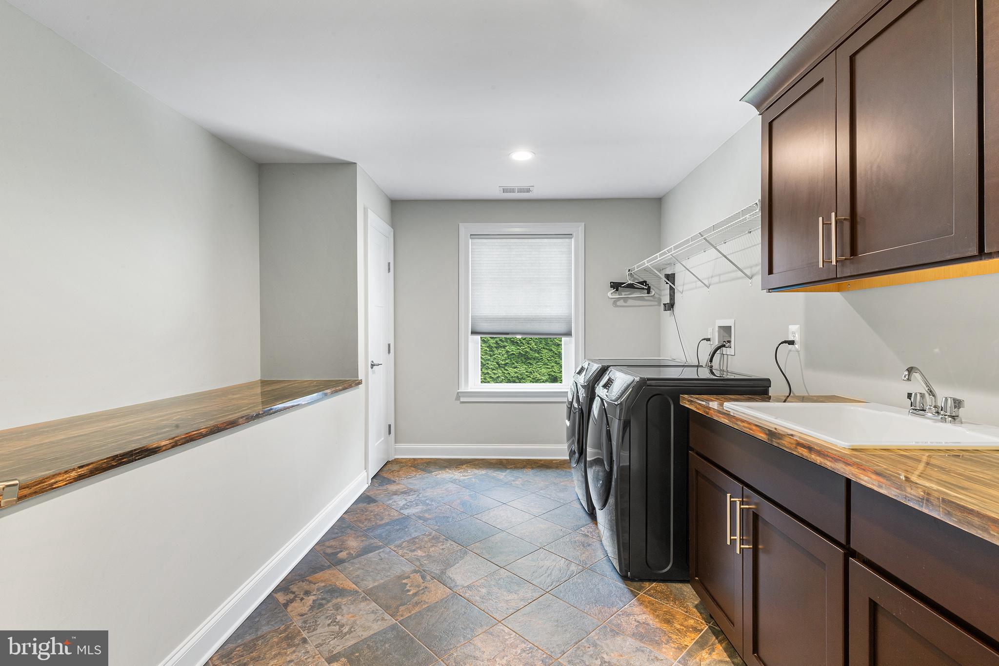 1407 Hagys Ford Road Penn Valley, PA 19072 - Photo 18 of 51 a kitchen with a sink and a refrigerator