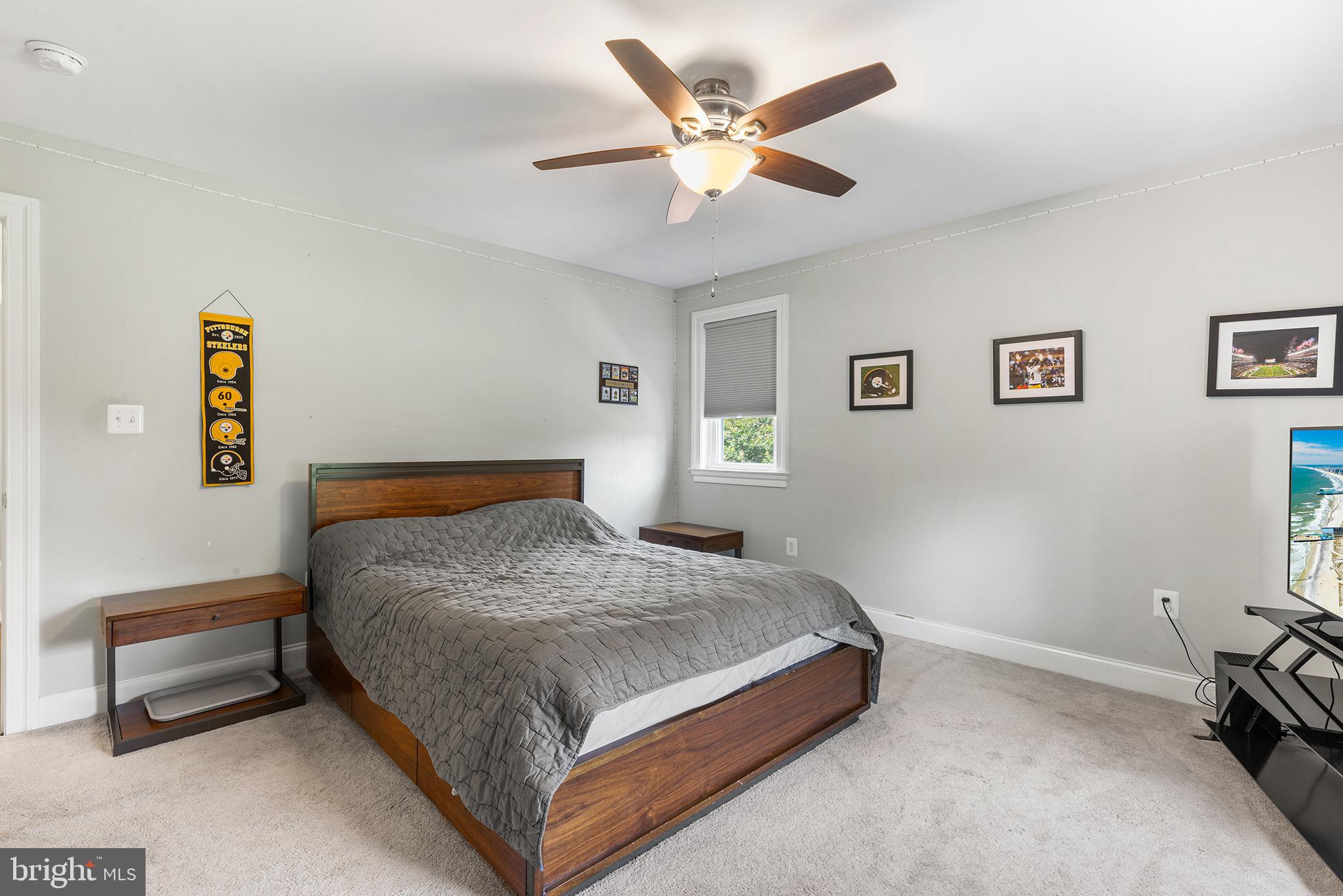 1407 Hagys Ford Road Penn Valley, PA 19072 - Photo 34 of 51 a bedroom with a bed and a chandelier