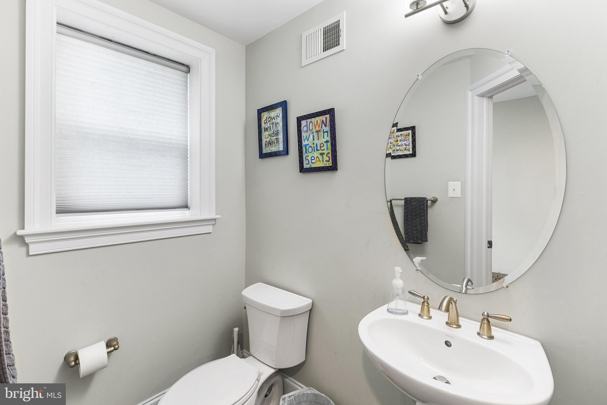 1407 Hagys Ford Road Penn Valley, PA 19072 - Photo 45 of 51 a bathroom with a toilet sink and mirror