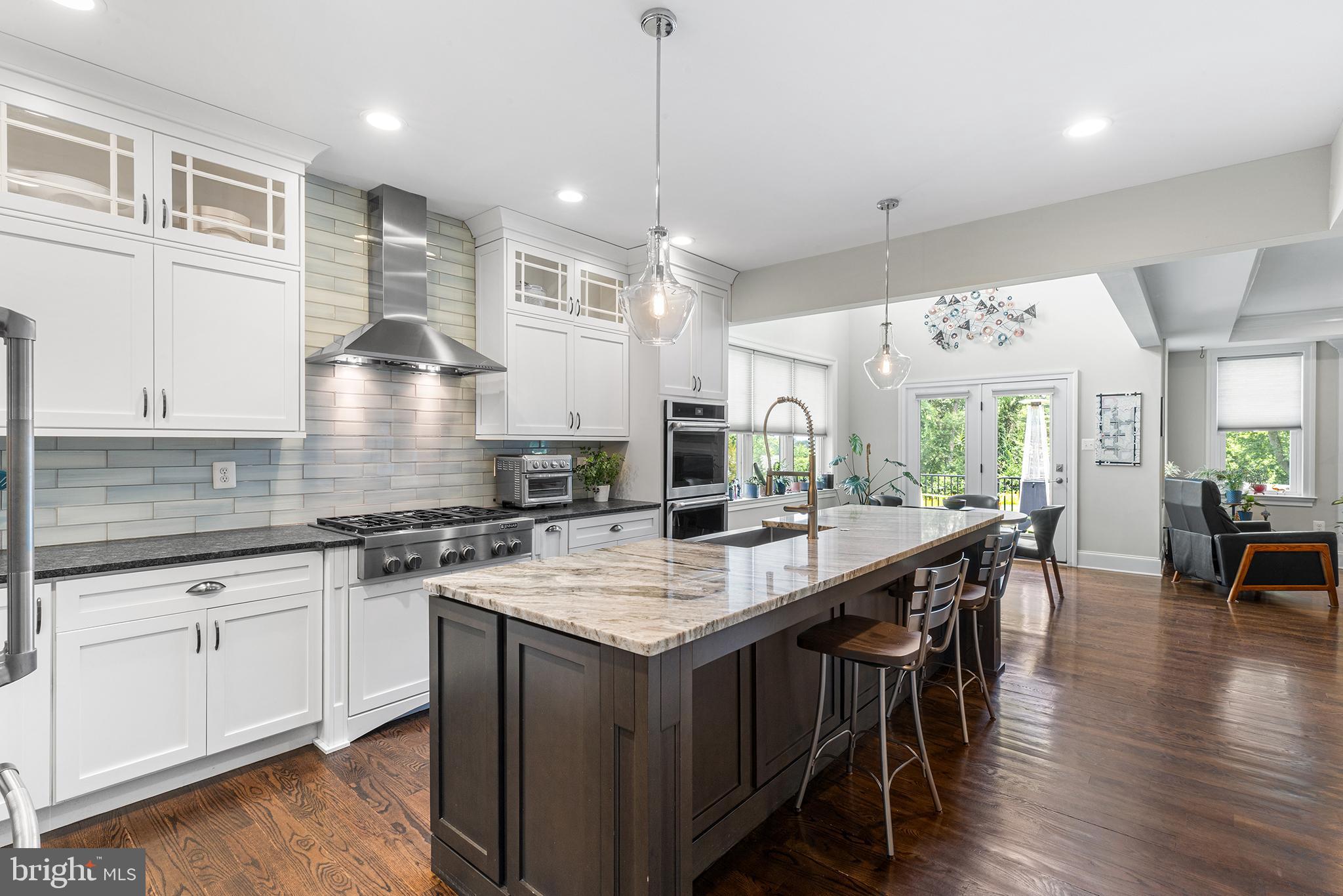 1407 Hagys Ford Road Penn Valley, PA 19072 - Photo 8 of 51 a kitchen with a stove a sink a dining table and chairs