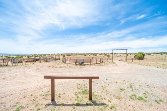 a view of a room with a table and chairs